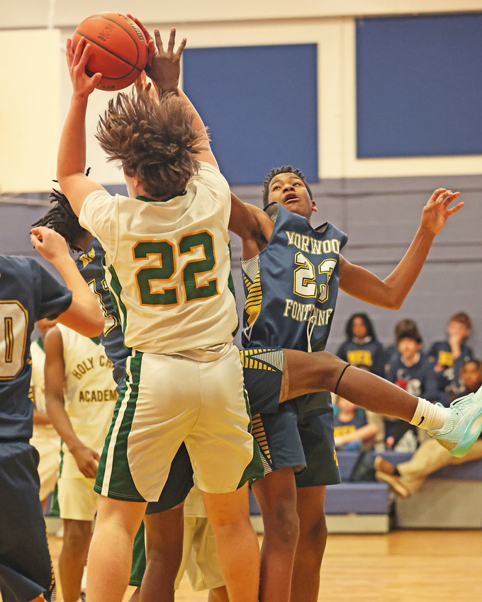Norwood's LJ Brown (right) defends against Patrick Reagan (#22) of Holy Child Academy. (Photo by Tom Utescher)