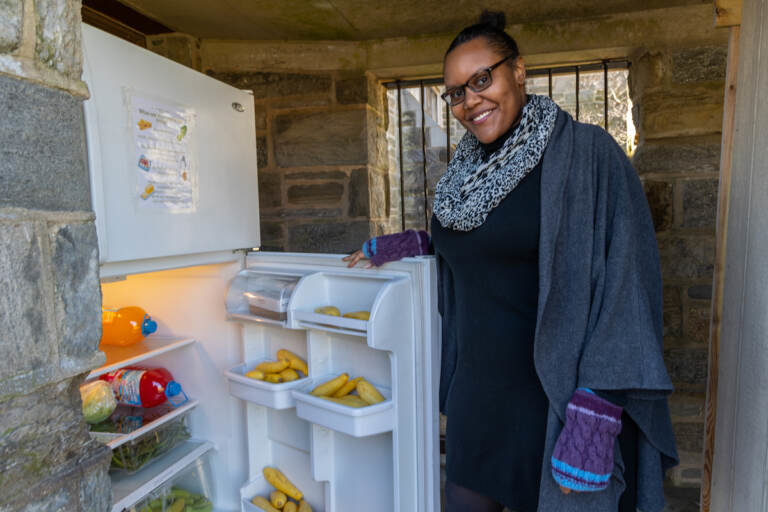 Nicole Williams, co-managing directer of the Mt. Airy food pantry, shows off the squash, green beans and peppers in their community fridge at the Unitarian Universalists of Mt. Airy Church on Stenton Ave.
