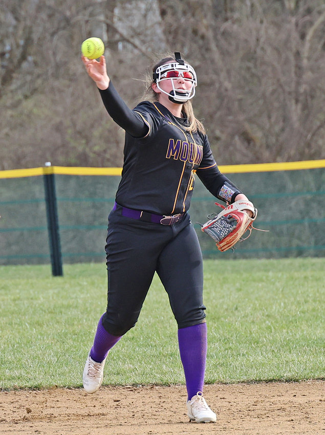 Sophomore Jewel Schaefer makes a throw from shortstop after moving over from first base when the Magic made a pitching change.  (Photo by Tom Utescher)
