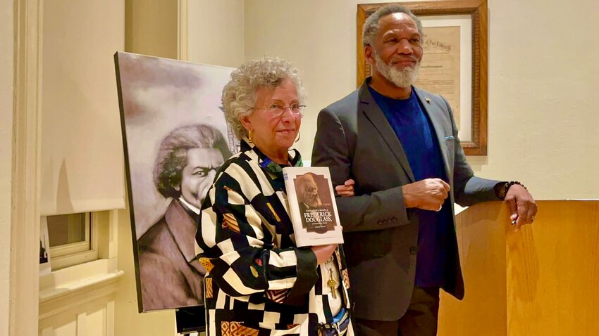 Marsha Stender, librarian and manager of Mt. Airy's Lovett branch of the  Free Library of Philadelphia until her retirement early this month, welcomes Kevin Douglass Greene, great-great-grandson of the abolitionist, author and social reformer Frederick Douglass, who spoke at Lovett on Feb. 15.