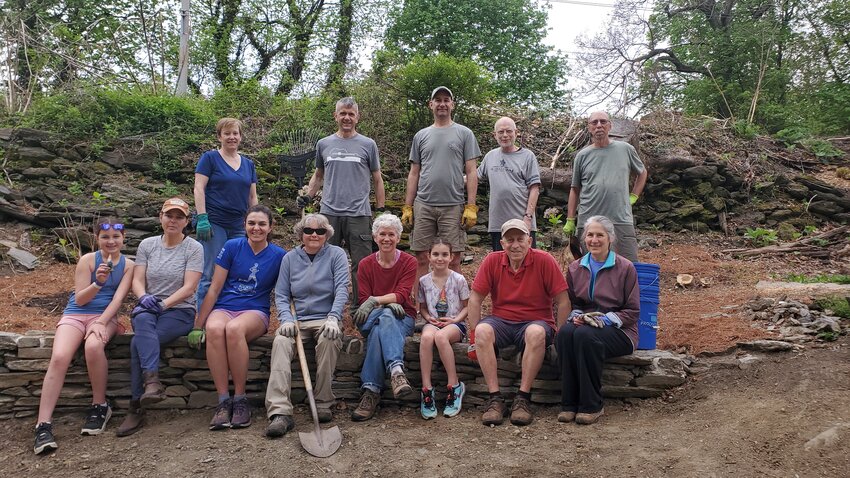 Highland Station Native Gardens Group members seated on Tyler's Wall, a new feature at the Gardens on Graver's Lane constructed by neighbor Tyler Schoen. Standing from left to right are Betsy Torg, Fabrizio Franco, Jason LaRocco, Norman Silver and Christopher Sohnly. Seated from left to right are Tilly Larocco, Emily Hawkins, Pamela Hans, Tracy Gardener, Beth Wright, Mackenzie LaRocco, Elliot Rood and Anne von Scheven.