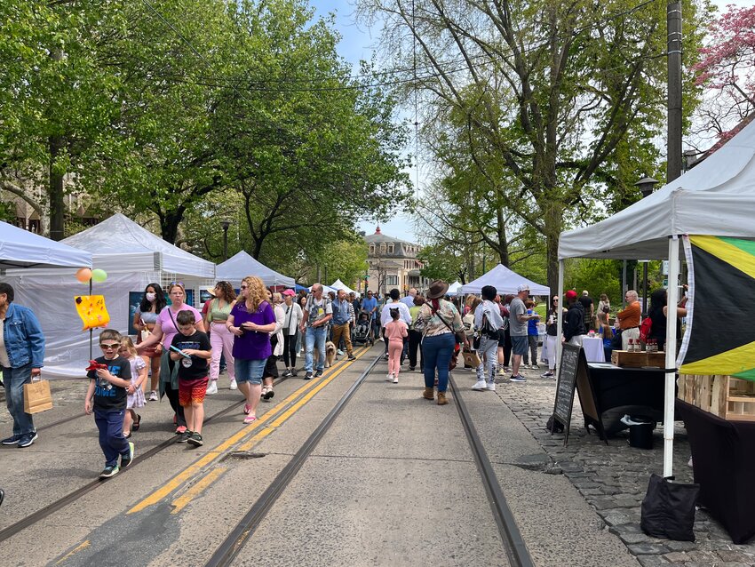 Festival-goers stroll along Germantown Avenue during last year's Chestnut Hill Home &amp; Garden Festival.