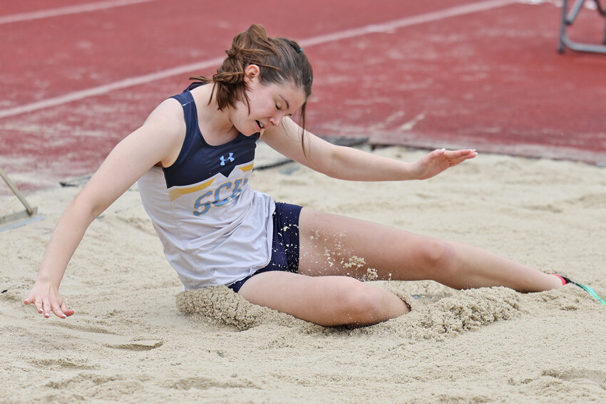 It's a sandy landing in the jump pit for SCH's Grace Hannigan. The senior won the bronze medal in the triple jump.