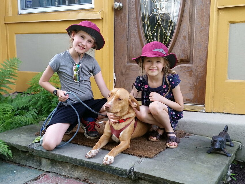 Cruz' two children, Yvie and Kate (left to right), help her with her dog training business. &ldquo;My children and I started off walking Barley,&rdquo; Cruz said.