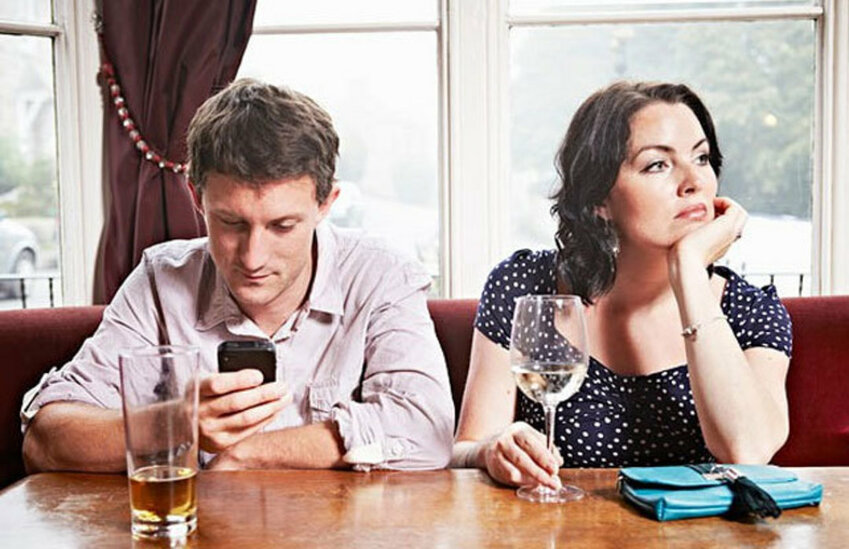 Has it now become acceptable for people to talk and/or text while having dinner with friends or family?