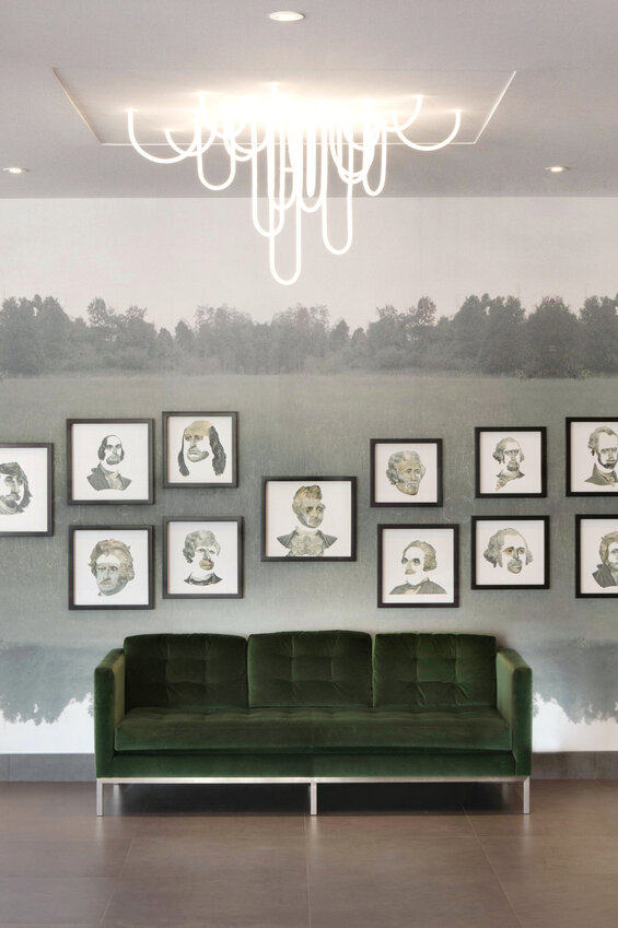 The new lobby of the Madison Building on City Avenue features &ldquo;kitschy&rdquo; cutouts of presidential portraits and custom-made neon light fixtures.