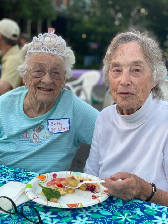 Betty Trout (left) with Helen Seitz, was crowned &ldquo;Most Senior Neighbor&rdquo; at Cresheim Village Neighbors' annual multi-block party last year.