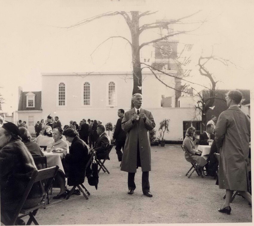 In this 1961 photo, George Woodward Jr. (center) stands in the parking lot in the 8600 block of Germantown Avenue where one of Chestnut Hill&rsquo;s recently felled trees once stood.