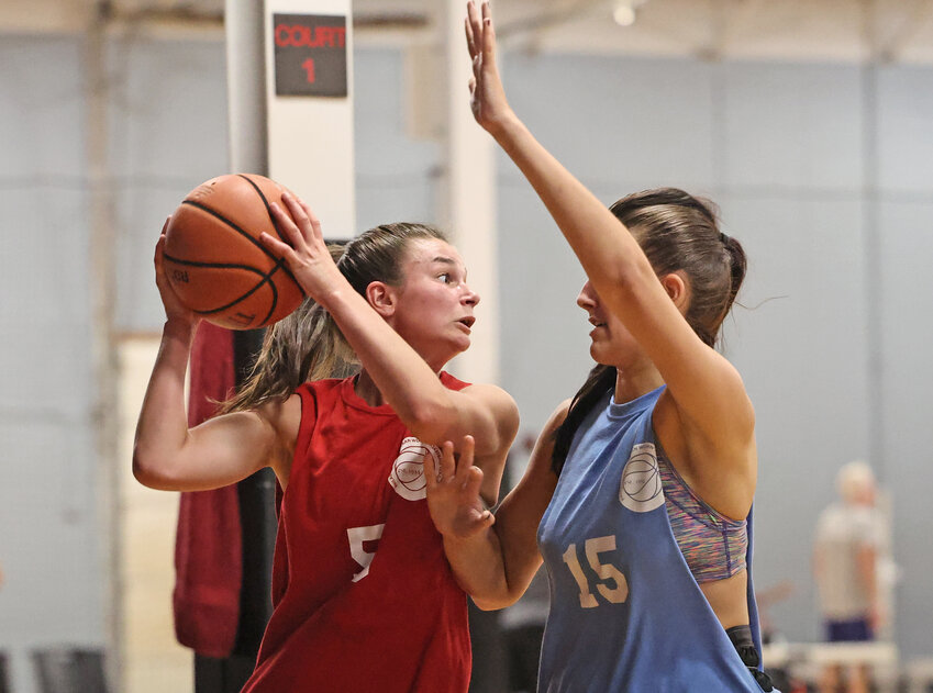 Incoming Chestnut Hill College freshman Caraline Herb (left) shields the ball from Claire Dougherty of Sky Blue Holy Family.