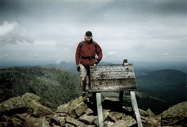 Jack Taylor, an avid mountain climber, at the summit of Mt. Katahdin in Maine.