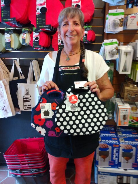 Doreen Greenberg, sales associate at Kitchen Kapers, with some of this year&rsquo;s popular lunch bags.