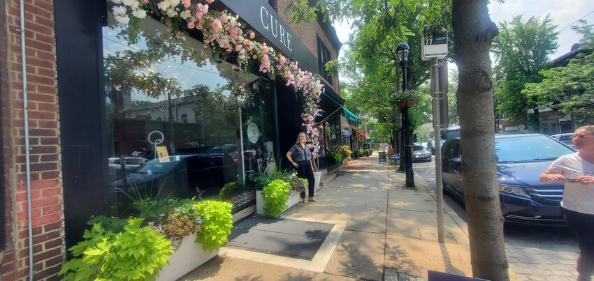 Chrissy Dress, owner of Cure de Repos in Chestnut Hill, was inspired by a recent trip to Paris to decorate the exterior of her beauty and skin care spa with a wreath of peonies, dahlias, magnolias and cherry blossoms -- a design she says is fitting for a neighborhood known as Philadelphia's garden district.