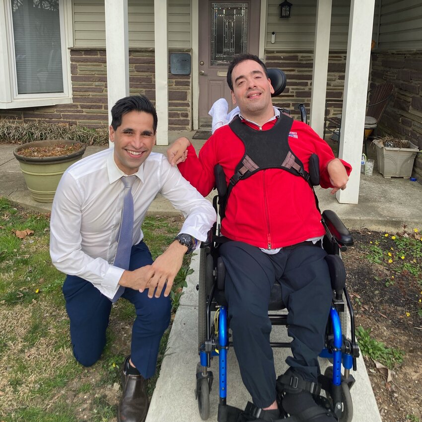 State Rep. Tarik Khan (left) with legislative advocate Michael Anderson, the inspiration behind Michael&rsquo;s Law, a bill that would require venues to waive admissions for personal aides when their presence is needed to assist people when they attend events.