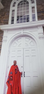 The Rev. Ethelyn Taylor stands at the door of her former congregation, Oxford Presbyterian Church in Mt. Airy. Taylor, pastor at Oxford for 30 years, recently retired after expanding the membership, programming and community involvement of the congregation.