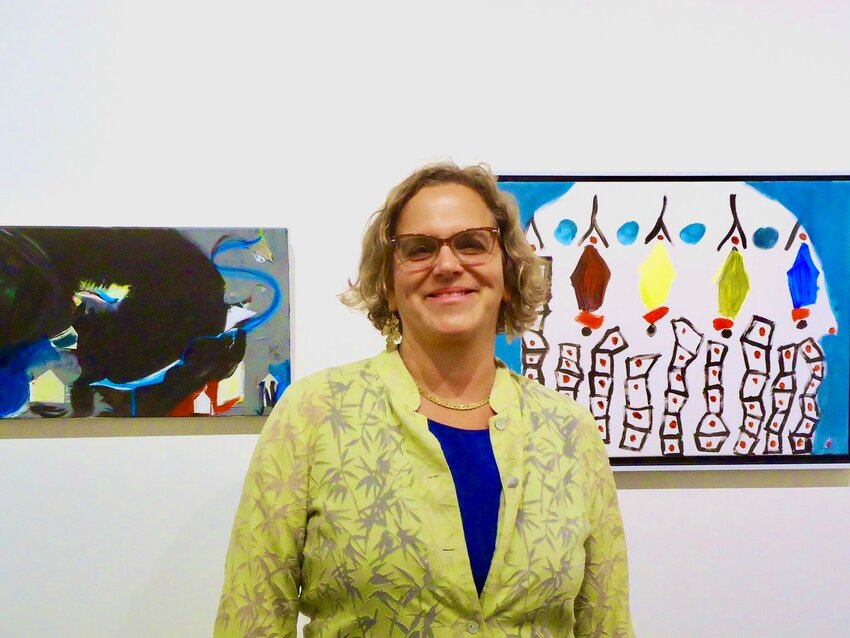 Lesnick is seen with the current exhibit of her work at Cerulean Arts Gallery and Studio, 1355 Ridge Ave. in the city's Spring Garden section, which will continue through Oct. 8. Photo by Tina Rocha