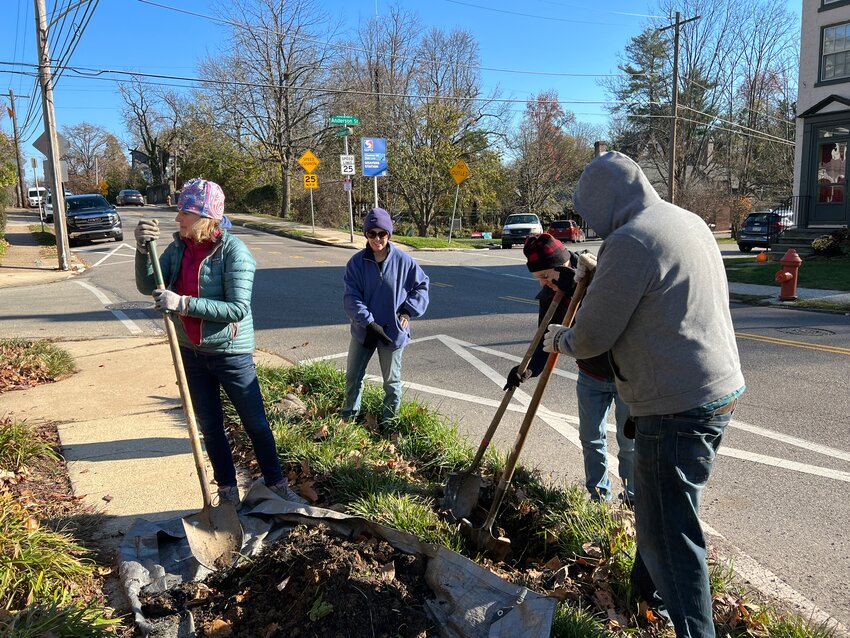 Chestnut Hill Tree Tenders (from left to right) MaryAnn Boyer, Julie Byrne, Larry McEwen and Tim Breslin plant a tree near the Gravers Lane train station last fall.