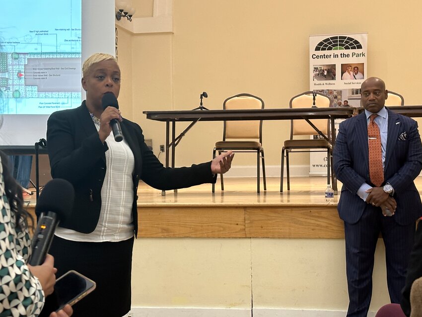 City Councilmember Cindy Bass discusses redevelopment plans for the Germantown YWCA at a community meeting last Thursday while developer Keith B. Key, who was awarded the contract in 2016, looks on.