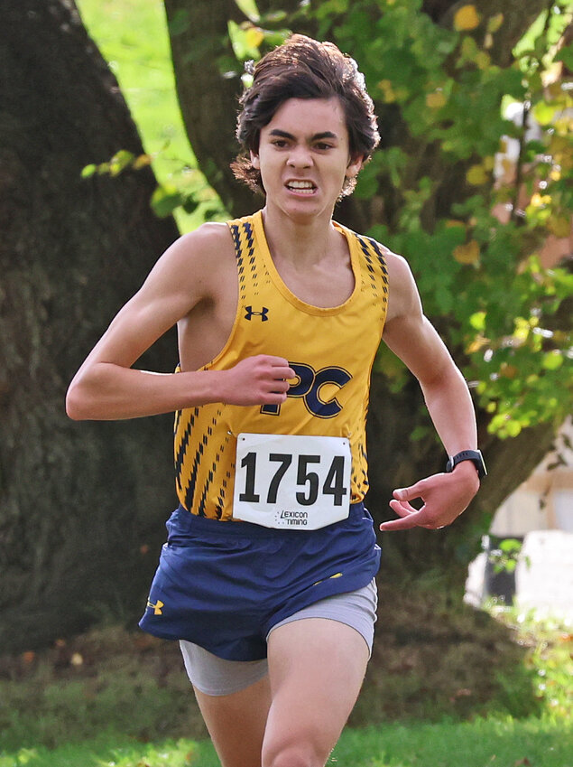 Penn Charter junior T.J. Zwall leads the Inter-Ac championship meet as he approaches the final turn on the Belmont Plateau course.