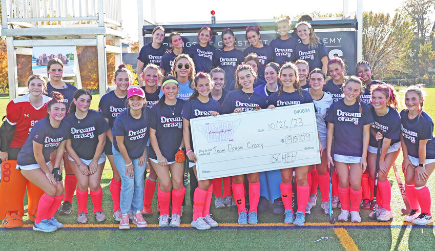 Members of the Springside Chestnut Hill Academy field hockey team raised more than $900 in support of breast cancer awareness and research.