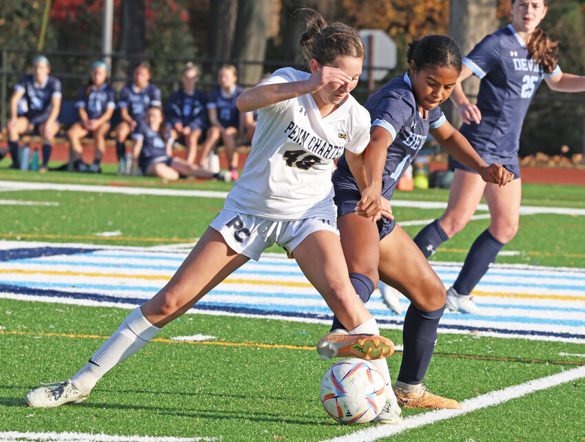 Penn Charter sophomore Carly Lewinski (left) tries to keep the ball away from freshman Deus Stanislaus of the Blue Devils. (Photo by Tom Utescher)