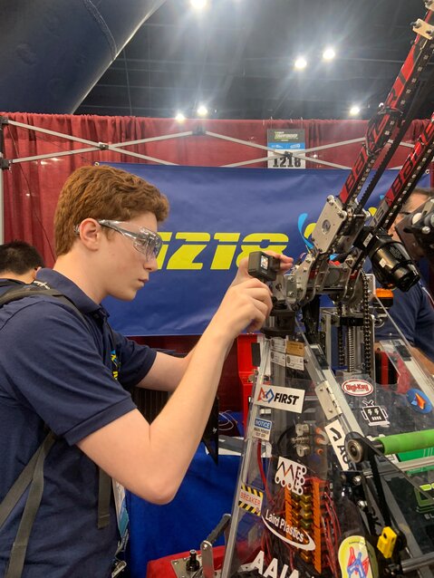 SCH Team 1218 member Jonathan Berkson mounts a Go-Pro camera to film the team's robot in action.