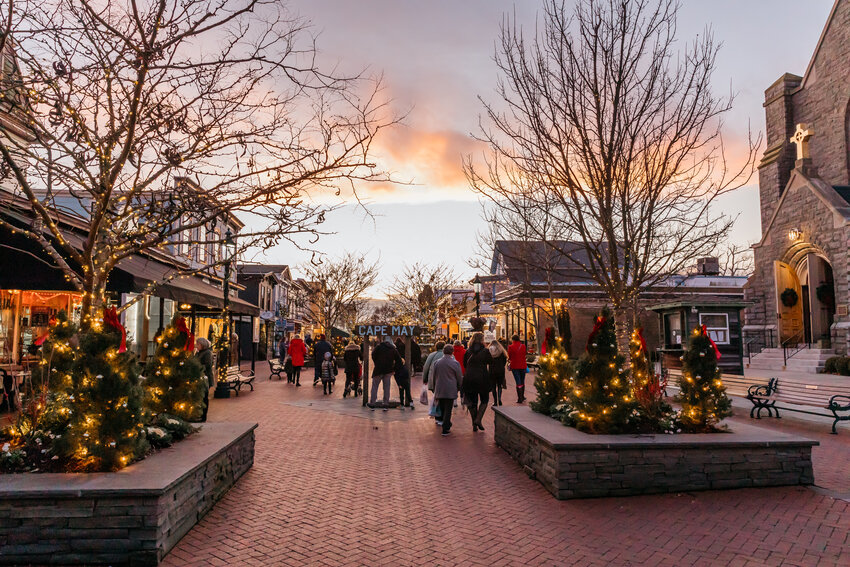 Christmas shoppers stroll Cape May's bustling Washington Street Mall, where visitors can get information and tickets to various tours and events.