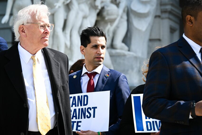 State Rep. Tarik Khan (center) at a rally to support legislation that prohibits hate crimes.