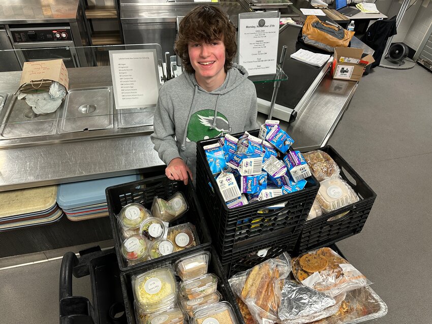 Springside Chestnut Hill Academy sophomore Judah Meyer organizes unused food for delivery to the Whosoever Gospel Mission in Germantown.
