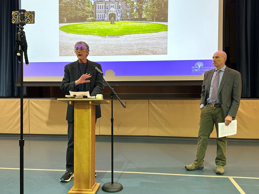 Brad Bank (left), a member of the Chestnut Hill Landmarks Committee, spoke out against amending easements for Greylock, an early 20th-century mansion, at the Chestnut Hill Conservancy&rsquo;s annual meeting Thursday night. David Dannenberg, another member of the Landmarks Committee, stands to Bank&rsquo;s left.