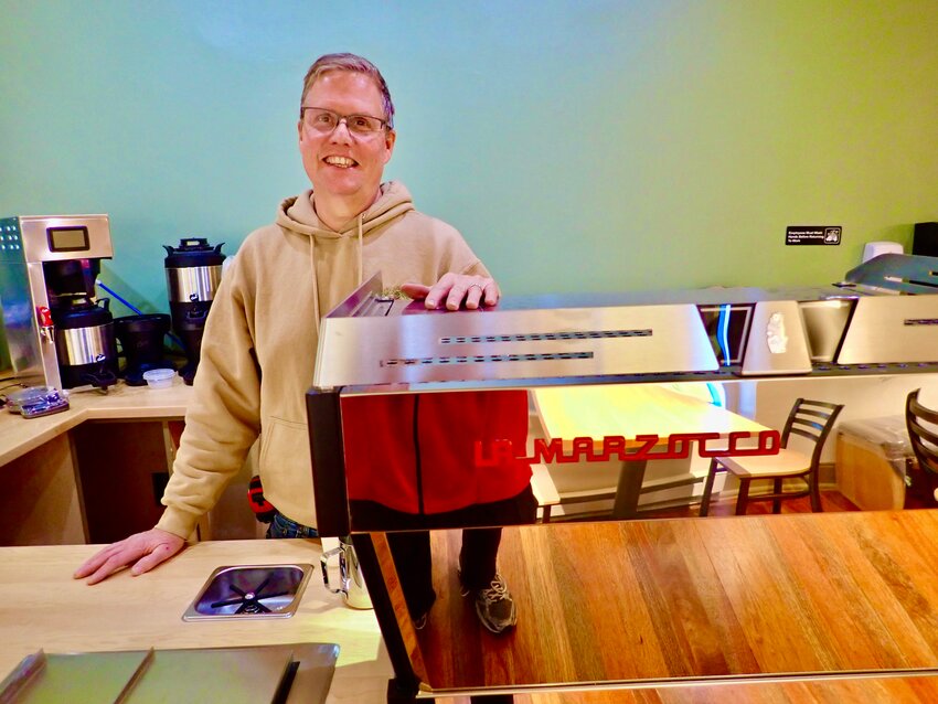 Christopher Petersen is in the final stages of completing the Mt. Airy Coffee Company, slated to open Feb. 18 at 7101 Emlen St. He is seen here with his top-of-the-line La Marzocco espresso machine, handmade in Florence, Italy.