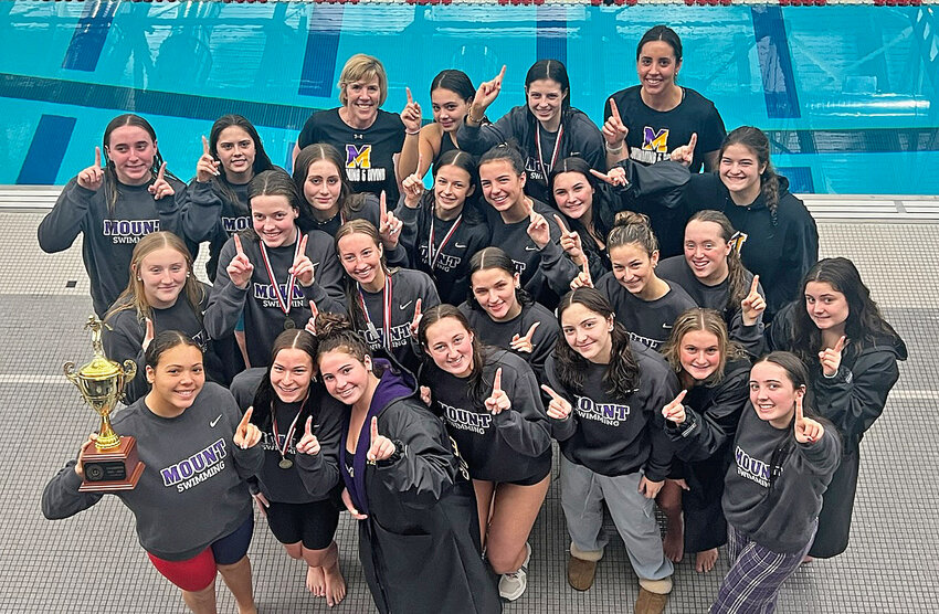 The Mount St. Joseph swim team is pictured just after the Magic won their sixth straight Catholic Academies championship.