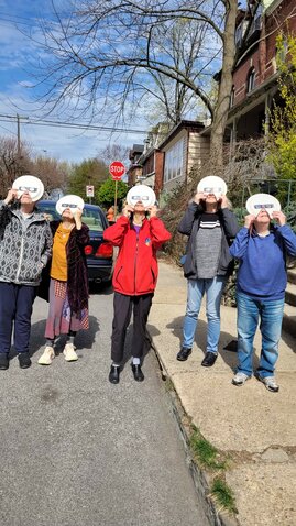 At locations around the region, residents gathered to experience the solar eclipse as a communal event, wearing glasses and looking skyward to catch a glimpse of an astronomical moment that isn't projected to happen again in the U.S. until 2044. In Mt. Airy, Margie Roth, Lois Rose, Mady Cantor, Rhonda Kutzik and Cathy Muir lined up with their homemade &ldquo;Moon Pie plates&rdquo; at the corner of West Mt. Airy Avenue and Bryan Street to watch the moon pass over the sun on Monday.