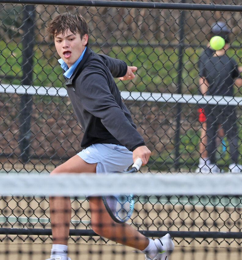 Blue Devils junior Drew Sharon hits a backhand shot in the second singles match.
