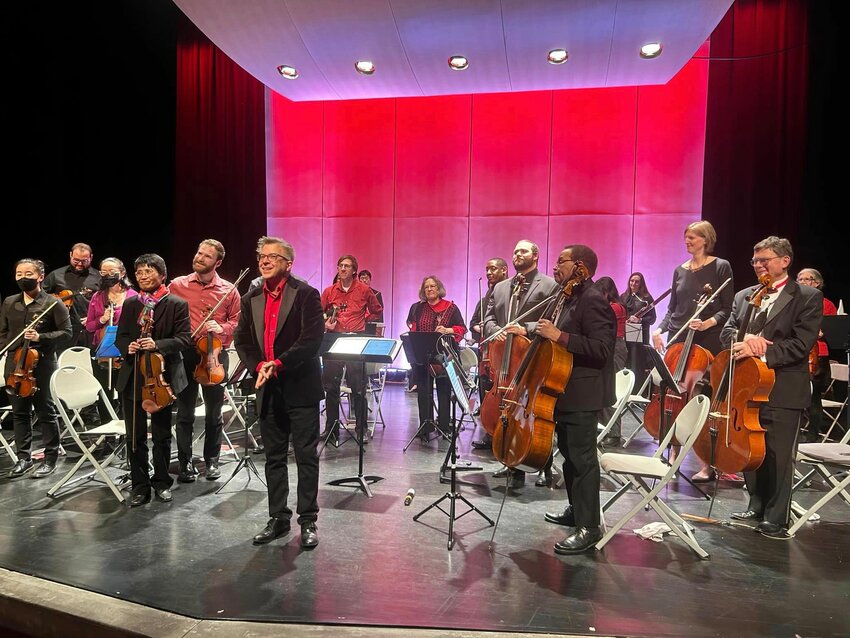 Director Michael Ludwig (center) and the Roxborough Orchestra take a bow in February during a concert at the Venice Island Performing Arts &amp; Recreation Center.
