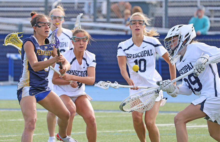 On this shot by Penn Charter senior Aditi Foster (left), Episcopal goalie Grace Holland came up with the save.