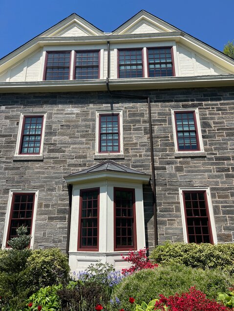 The distinctive architectural details of windows and doors correlate with specific styles and historic periods. This local home displays True Divided Light replacement windows on the third floor.
