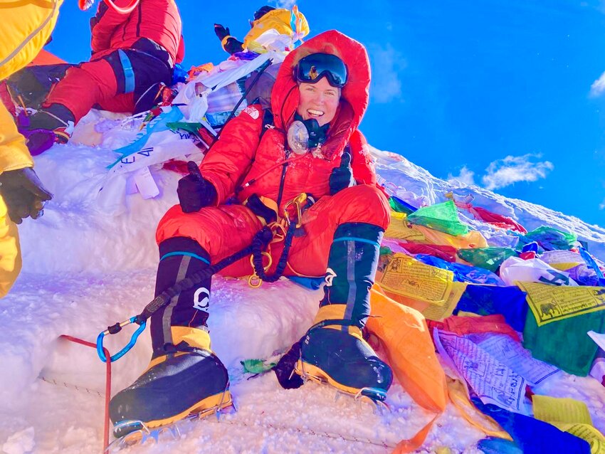 Megan Rath gives a &ldquo;thumbs up&rdquo; at the summit of Mount Everest, the world's tallest mountain, which she climbed in May of this year.