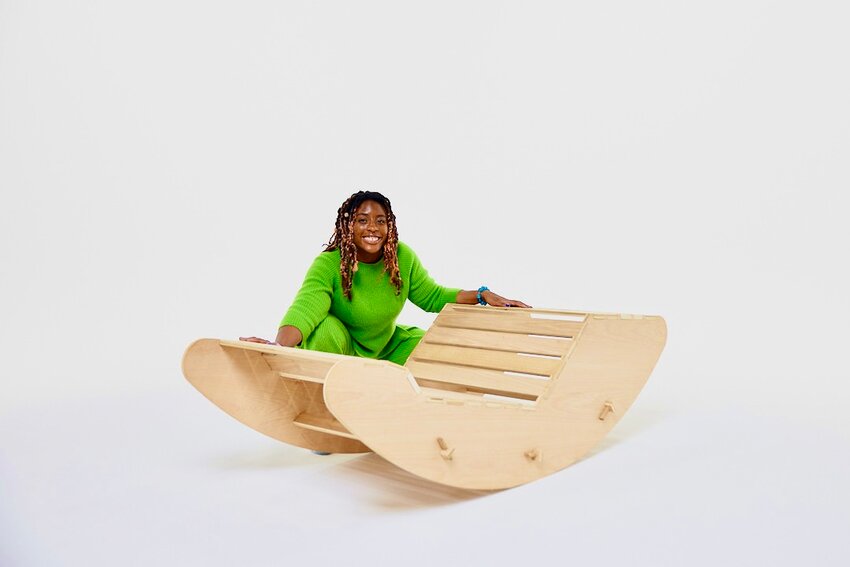 Nnennia Chikaodili Esther Mazagwu, of Chestnut Hill, demonstrates the &ldquo;Rest in Repose&rdquo; creation, a zero-gravity rocker that distributes body weight evenly and reduces pressure on the spine, simulating the sensation of weightlessness.