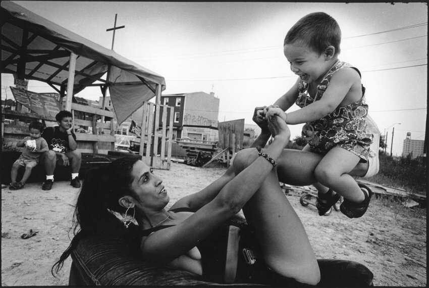 Photographer Harvey Finkle's &quot;Mariluz and Demitre Gonzalez, Kensington Welfare Rights Union Tent City II,&quot; Philadelphia, 1996.