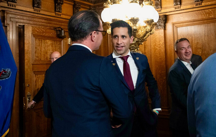 Rep. Khan speaks with Gov. Shapiro at the budget bill signing.