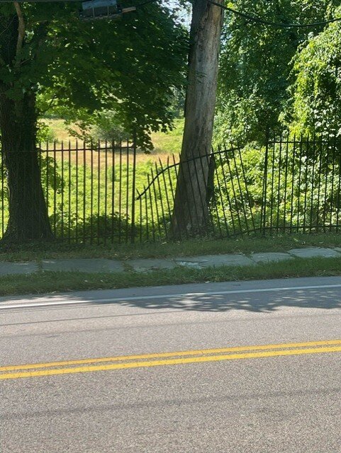 A broken fence at the Greylock property.