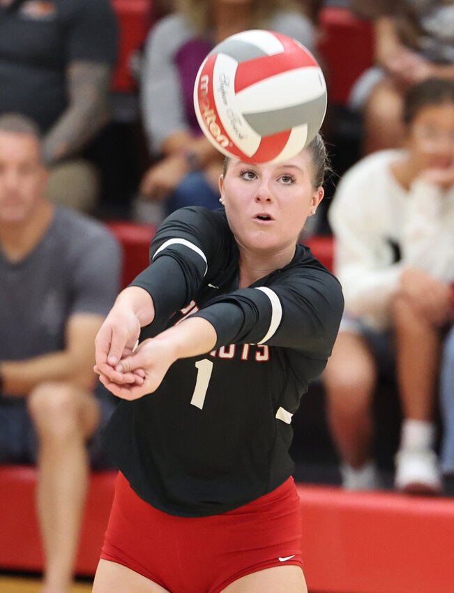 Senior libero Liv Reynolds focuses on a forearm pass during last Friday's home match.