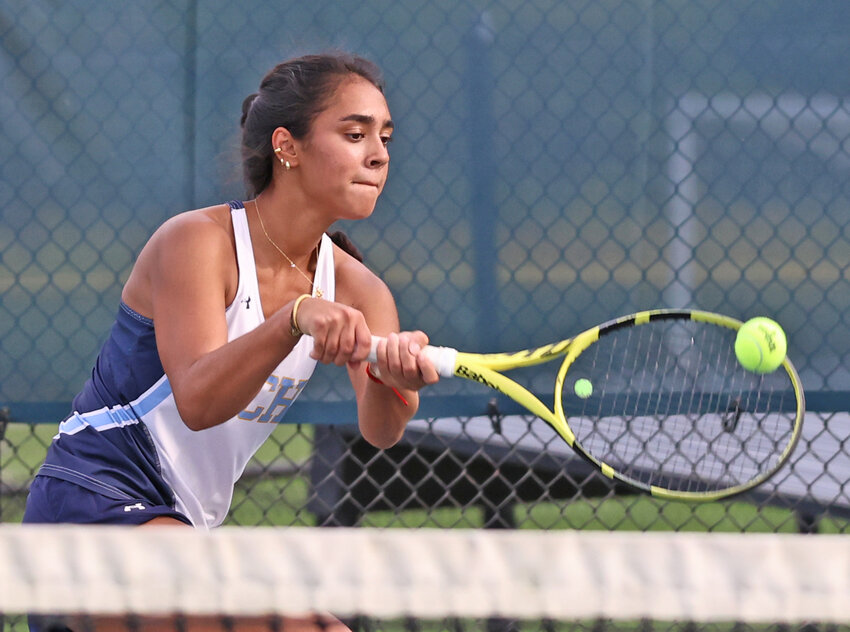 SCH junior Ariya Goswami comes to the net in the third singles match.