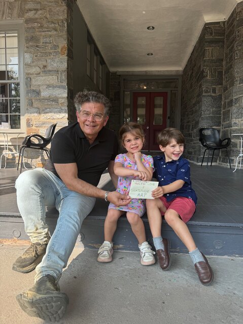 Woodmere Art Museum director Bill Valerio thanks Alaia Peale and Sebastian Cabrera, who hosted an iced tea stand to raise money for children's art  education.