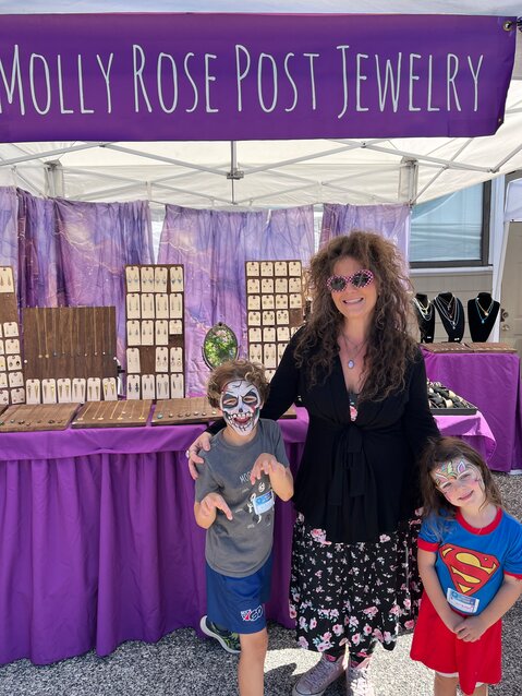 Molly Rose Post, of West Mt. Airy, seen here with her children, is a jewelry artist and one of many festival exhibitors on Saturday, Sept. 28.