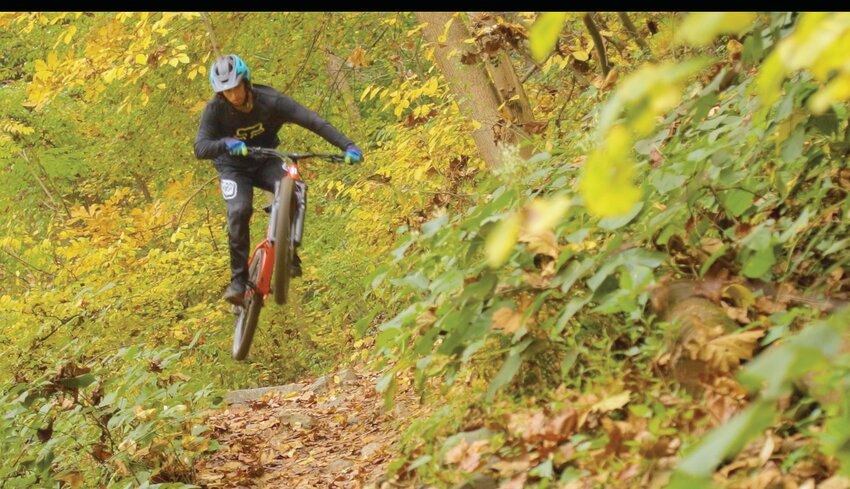 Amar Mohamed goes airborne on a Wissahickon trail.