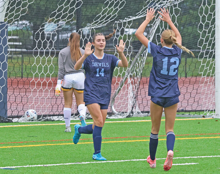 After scoring off of a rebound, SCH sophomore Alex de Beaulac (center) celebrates her second goal of the day with freshman teammate Nadia Bevan.