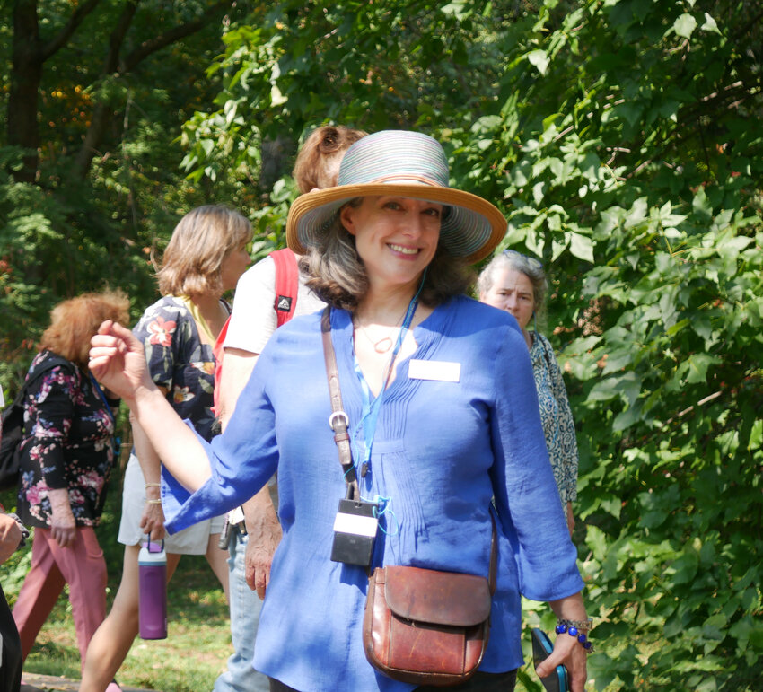 Lori Salganicoff, who helped the Chestnut Hill Conservancy grow in revenue, membership and personnel over her 10 years as executive director, at a &ldquo;2024 Discovering Chestnut Hill&rdquo; walking tour at Awbury Arboretum, led by architectural historian George McNeely.