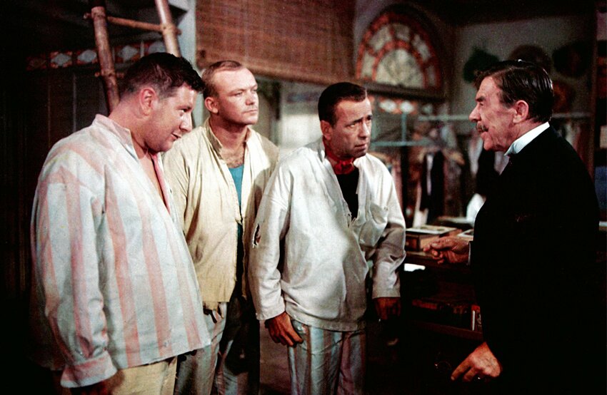 A shopkeeper played by Leo G. Carroll (far right) hires escaped convicts portrayed by (from left) Peter Ustinov, Aldo Ray and Humphrey Bogart in director Michael Curtiz's other Christmas classic &quot;We're No Angels,&quot; showing Tuesday, Dec. 10, at Woodmere art museum. (Curtiz also directed &quot;White Christmas.&quot;)