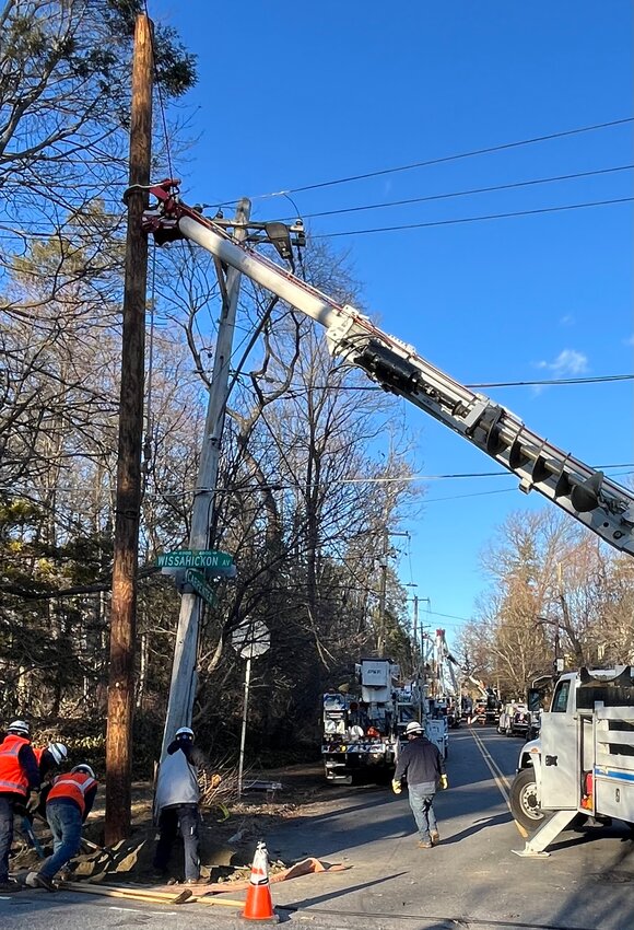 Downed power lines across the region forced PECO to call in reinforcements, such as this emergency response at Wissahickon Avenue and Carpenter Lane on Monday.